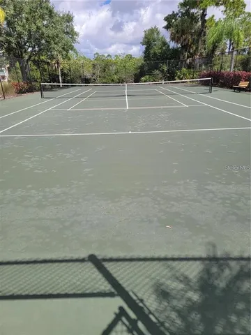 a view of street with parked cars