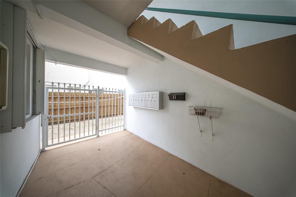 3525 Tyler Street, Unit 9 Hollywood, FL 33021 - Photo 14 of 24 a view of a livingroom with a staircase