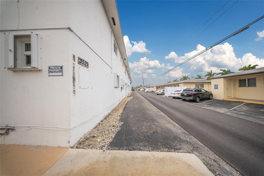 3525 Tyler Street, Unit 9 Hollywood, FL 33021 - Photo 16 of 24 a car parked on the side of the road