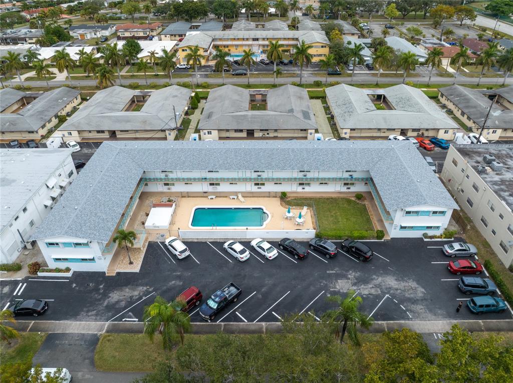 3525 Tyler Street, Unit 9 Hollywood, FL 33021 - Photo 22 of 24 an aerial view of a house with a swimming pool yard and lake view