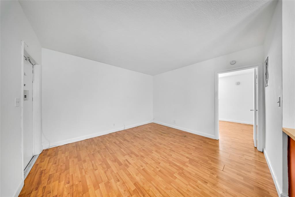 3525 Tyler Street, Unit 9 Hollywood, FL 33021 - Photo 9 of 24 a view of empty room with wooden floor