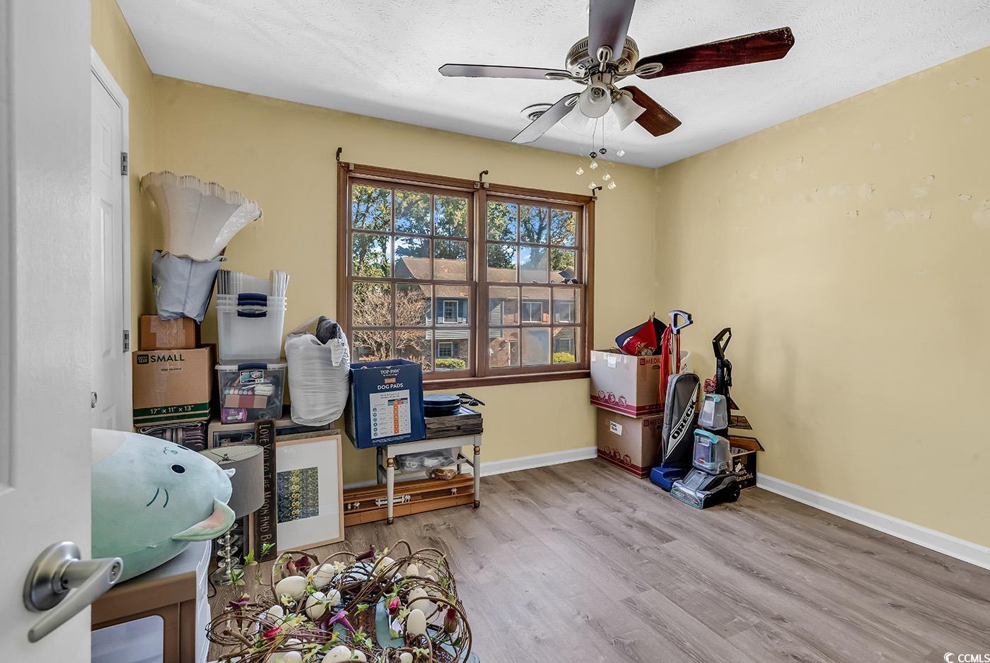 830 44th Avenue North, Unit I5 Myrtle Beach, SC 29577 - Photo 16 of 27 Rec room with wood finished floors, a ceiling fan, and a textured ceiling