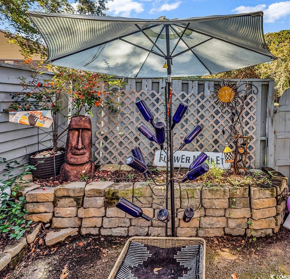 830 44th Avenue North, Unit I5 Myrtle Beach, SC 29577 - Photo 22 of 27 View of patio / terrace featuring a gate
