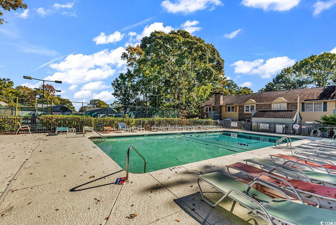 830 44th Avenue North, Unit I5 Myrtle Beach, SC 29577 - Photo 25 of 27 Community pool featuring a patio area