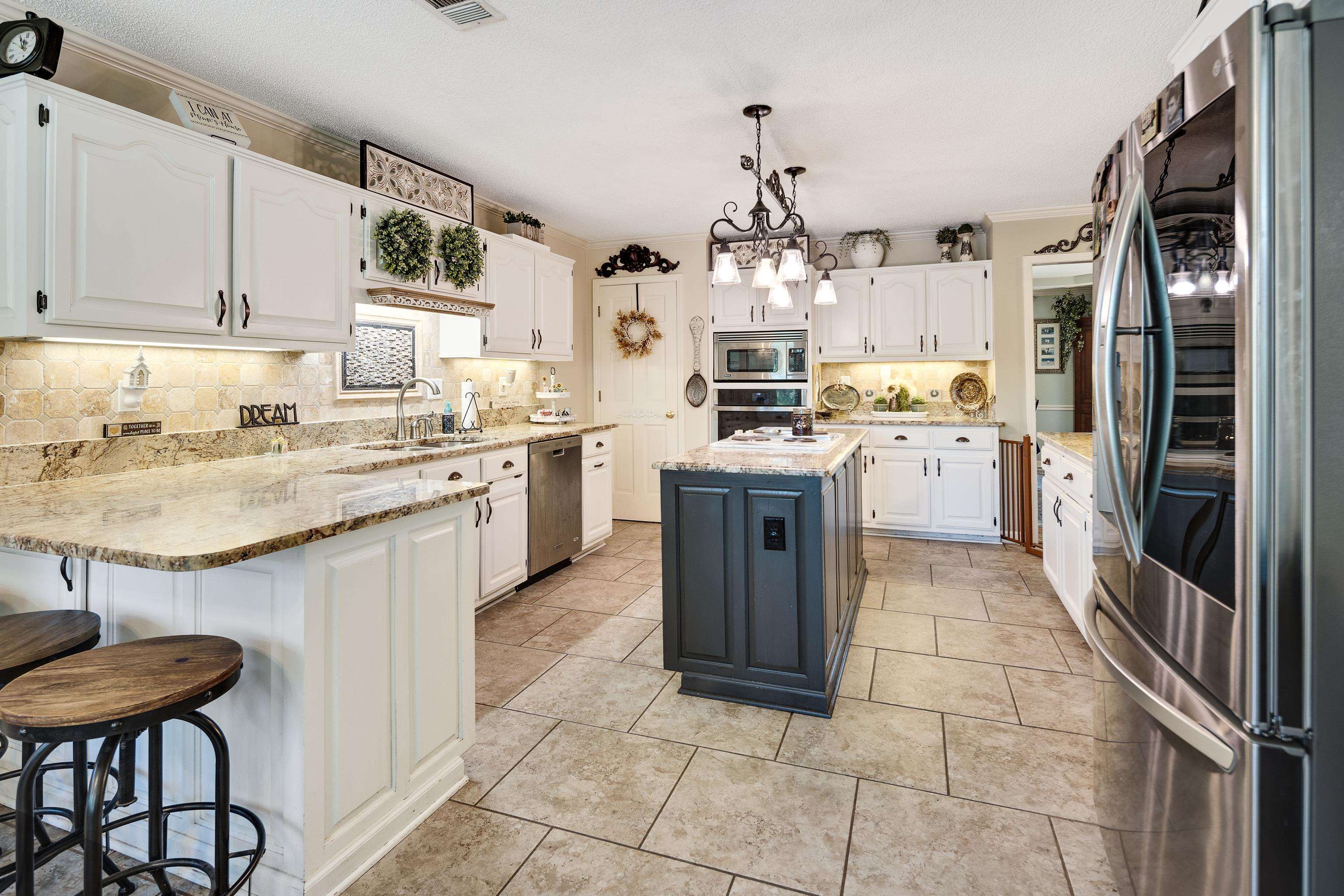 6119 Brunswick Road Arlington, TN 38002 - Photo 13 of 39 a kitchen with a sink counter top space appliances and cabinets