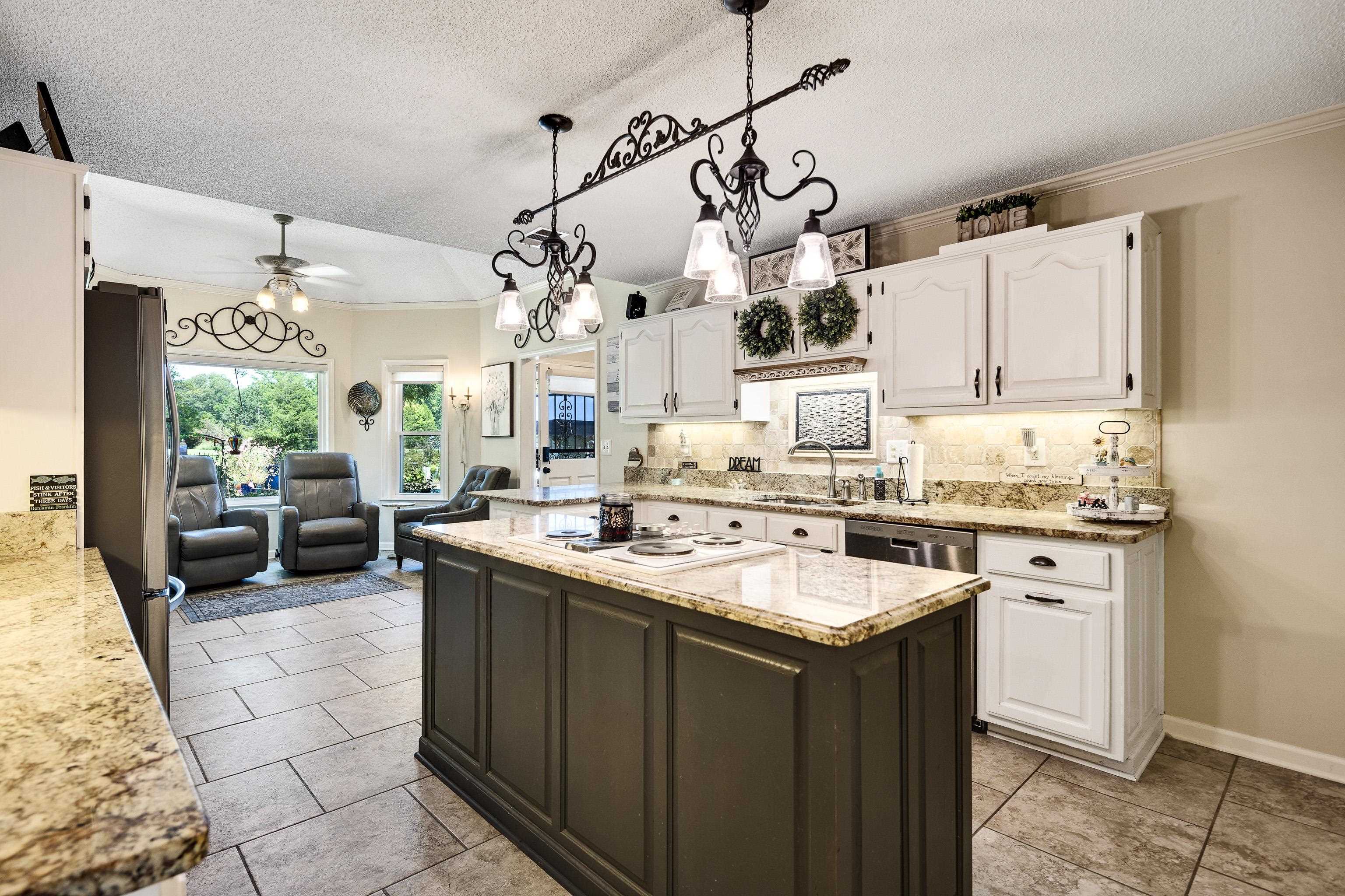 6119 Brunswick Road Arlington, TN 38002 - Photo 14 of 39 a kitchen with a sink stove and cabinets
