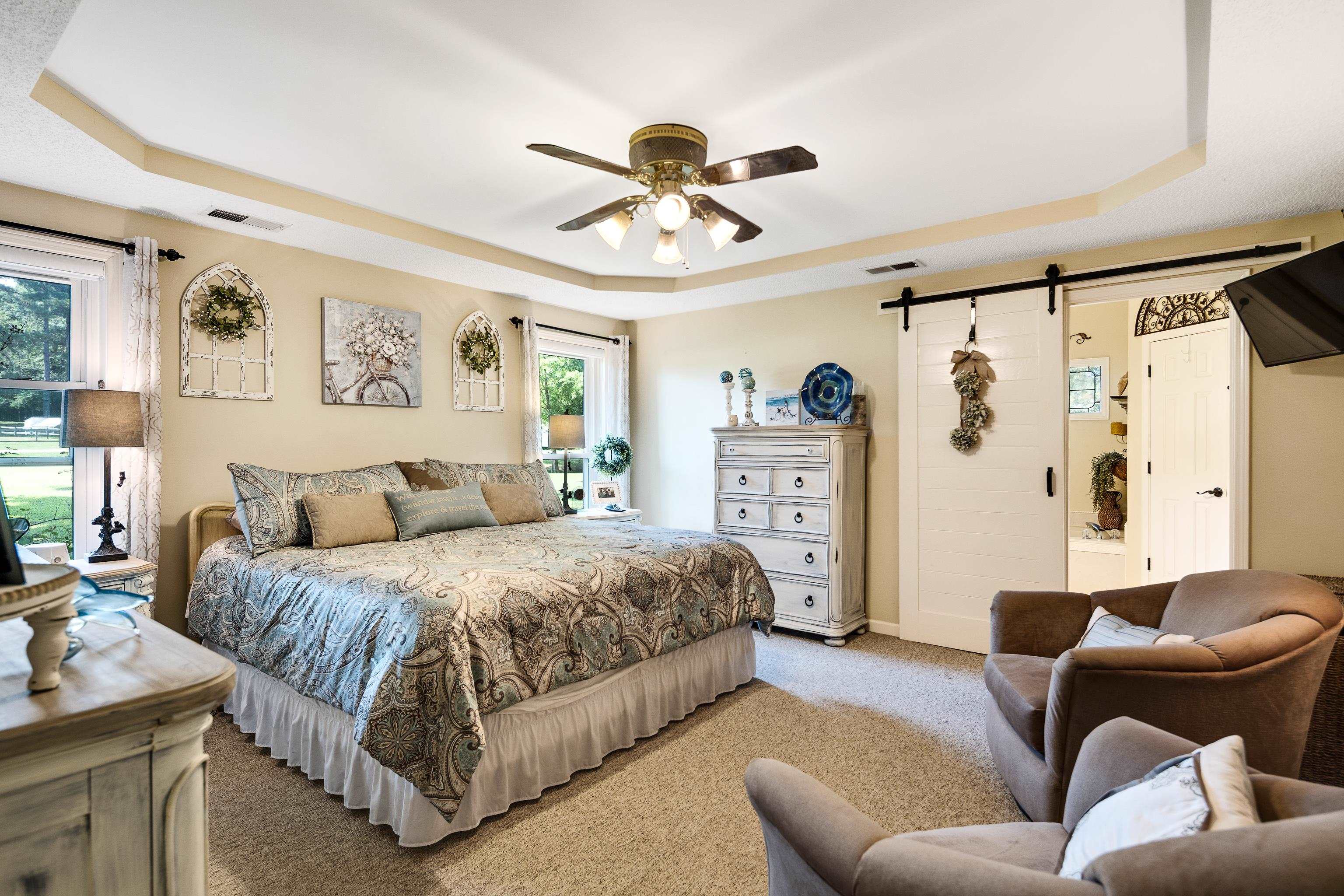 6119 Brunswick Road Arlington, TN 38002 - Photo 17 of 39 a spacious bedroom with a bed couch and window
