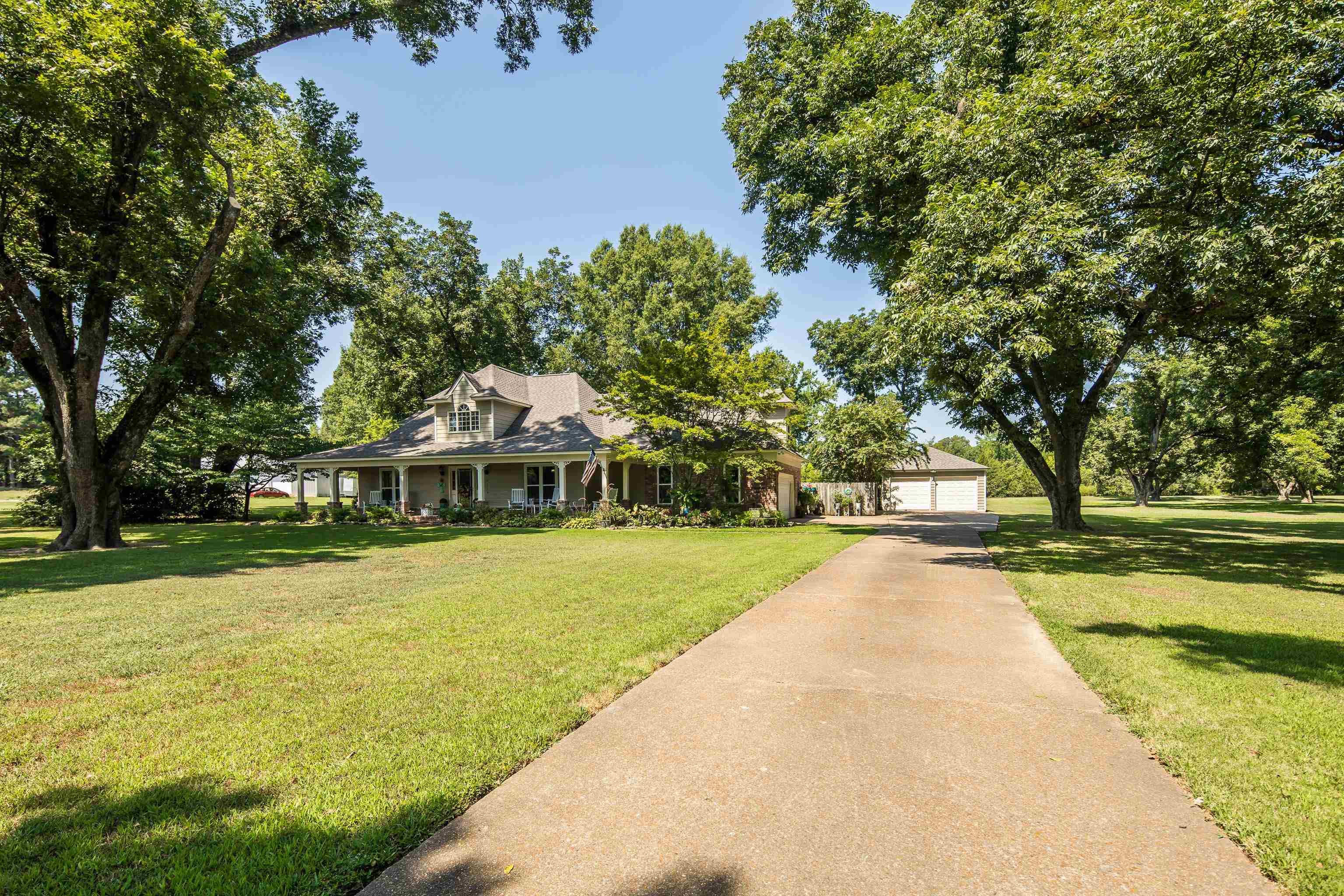 6119 Brunswick Road Arlington, TN 38002 - Photo 2 of 39 a front view of a house with a yard
