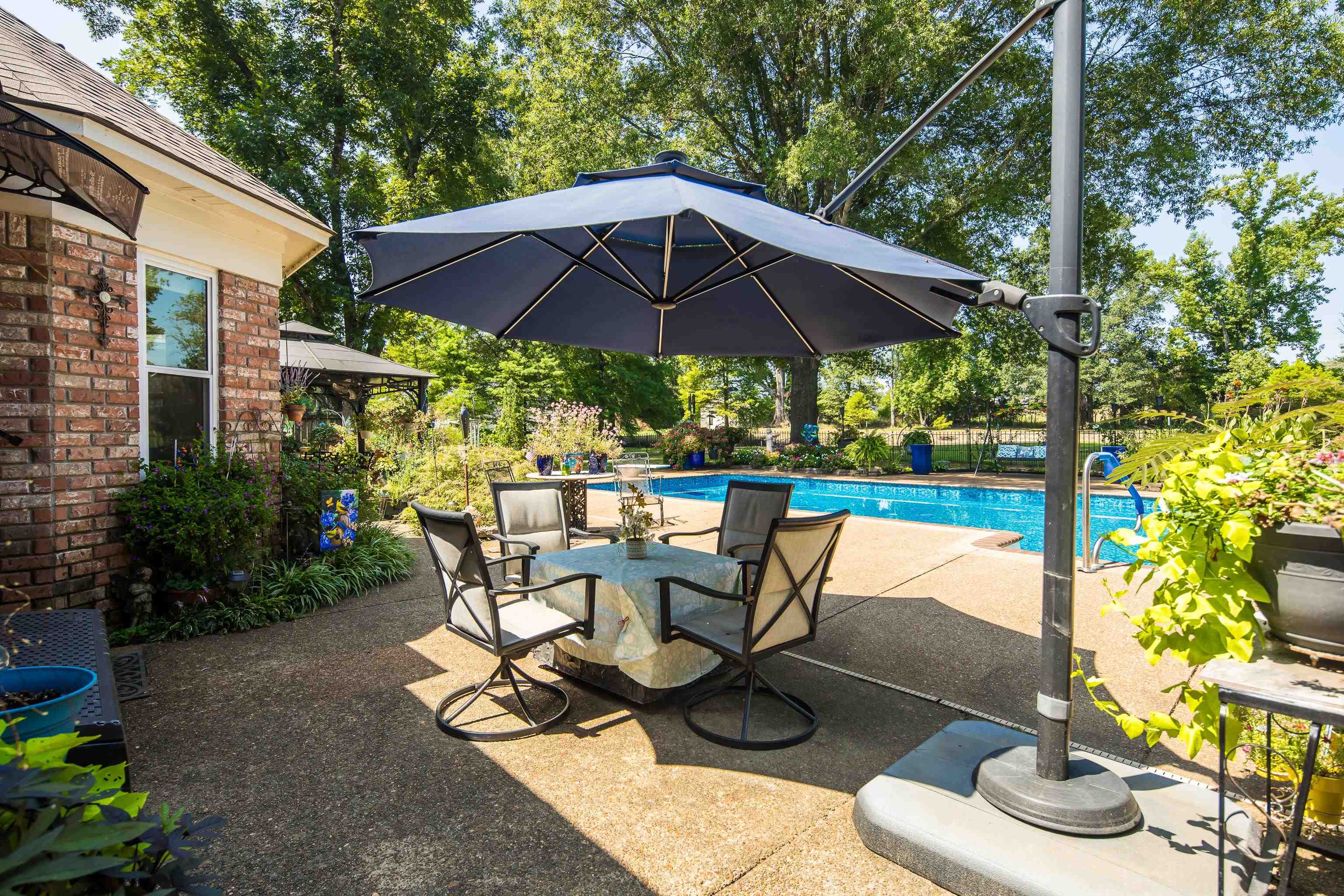 6119 Brunswick Road Arlington, TN 38002 - Photo 31 of 39 a view of a patio with table and chairs under an umbrella