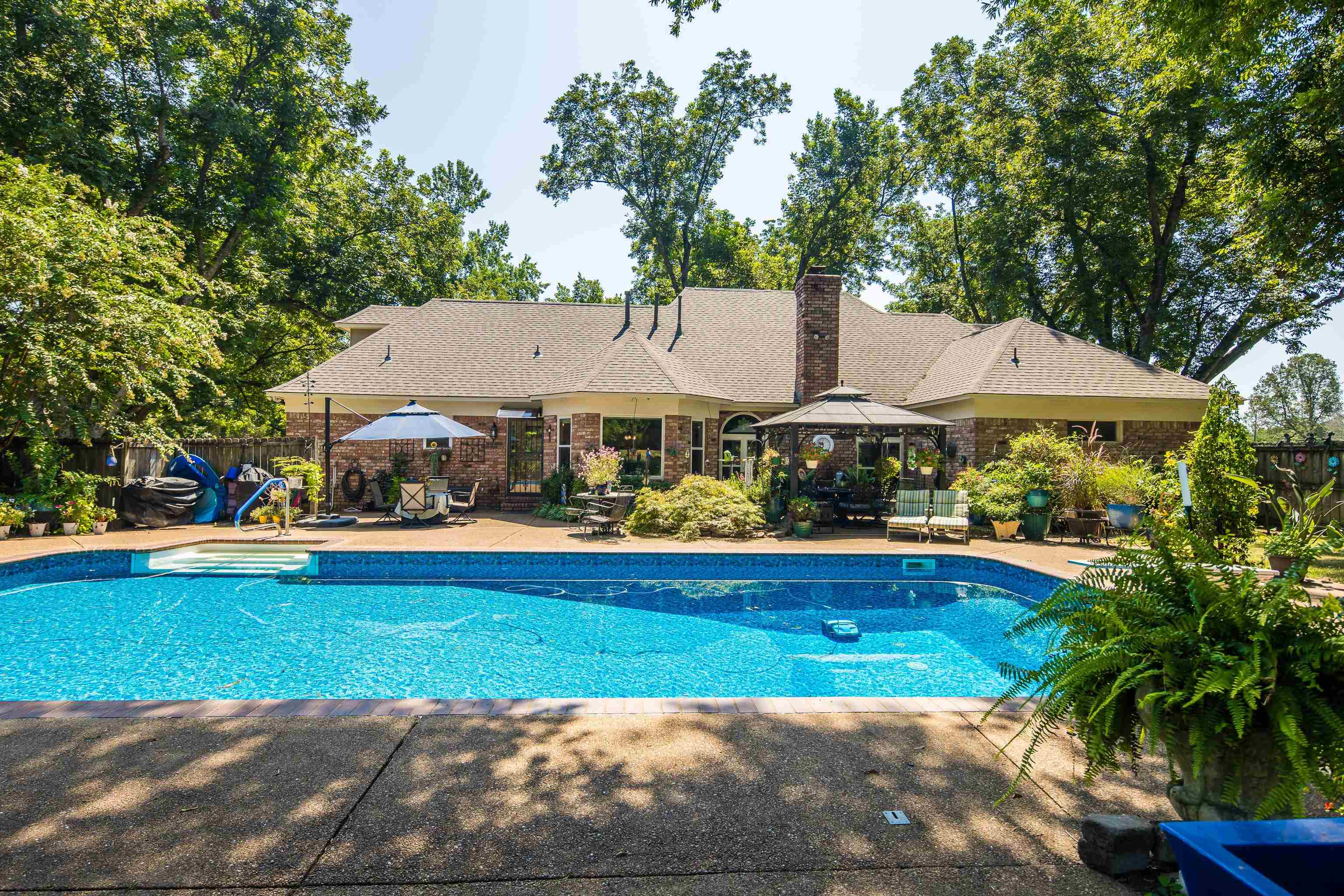 6119 Brunswick Road Arlington, TN 38002 - Photo 5 of 39 a view of house with garden space and swimming pool
