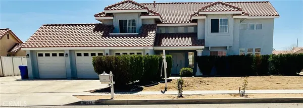 an aerial view of a house with a garden