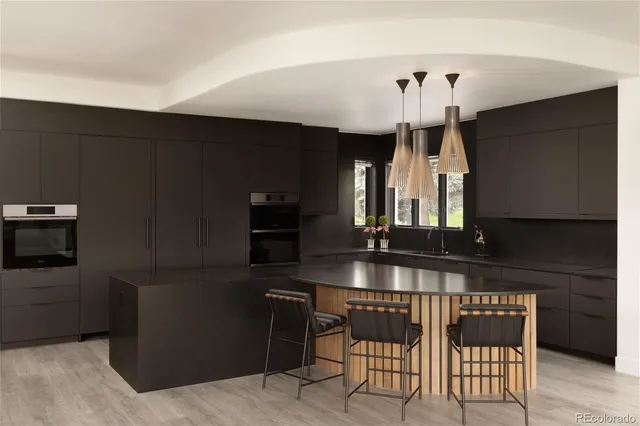 a dining room with furniture and wooden floor