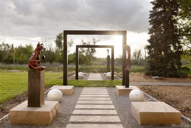 a front view of residential houses with yard and green space