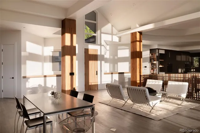 a view of a dining room with furniture and window