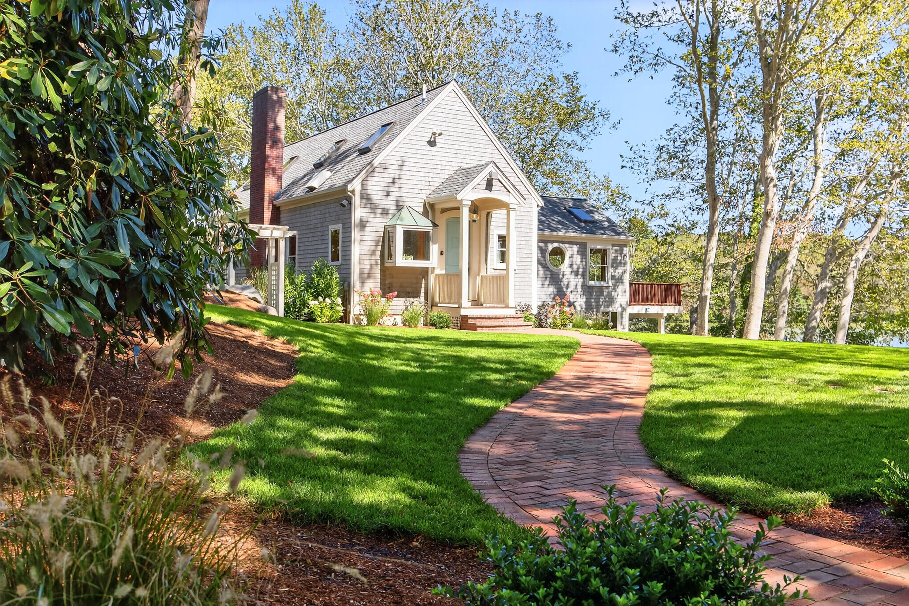 131 Timberlane Drive Mashpee, MA 02649 - Photo 3 of 57 a front view of a house with a yard