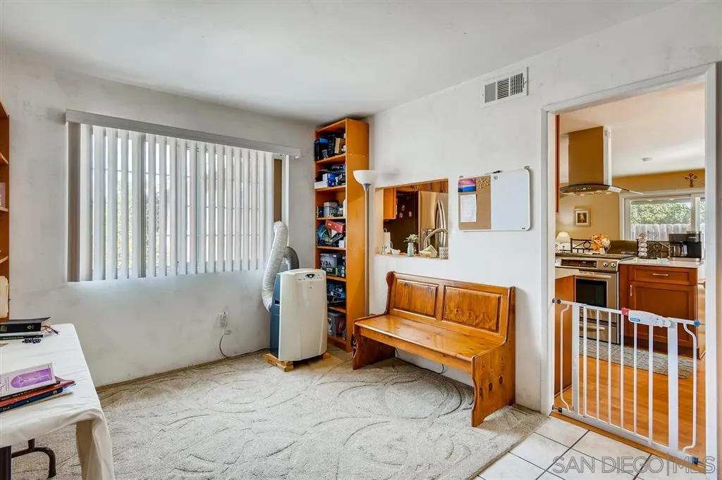 9809 Medina Drive Santee, CA 92071 - Photo 12 of 22 a living room with furniture and a floor to ceiling window