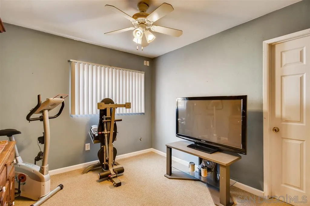 9809 Medina Drive Santee, CA 92071 - Photo 18 of 22 a room with gym equipment and windows