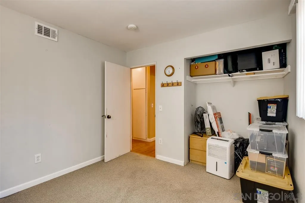 9809 Medina Drive Santee, CA 92071 - Photo 20 of 22 a view of a workspace with furniture and a flat screen tv