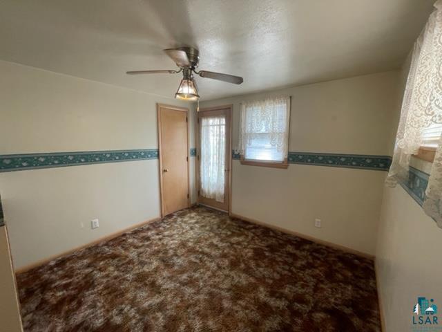 32 West Shagawa Road Ely, MN 55731 - Photo 18 of 26 Carpeted spare room with ceiling fan