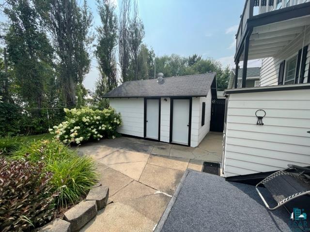 32 West Shagawa Road Ely, MN 55731 - Photo 20 of 26 View of patio / terrace with an outdoor structure