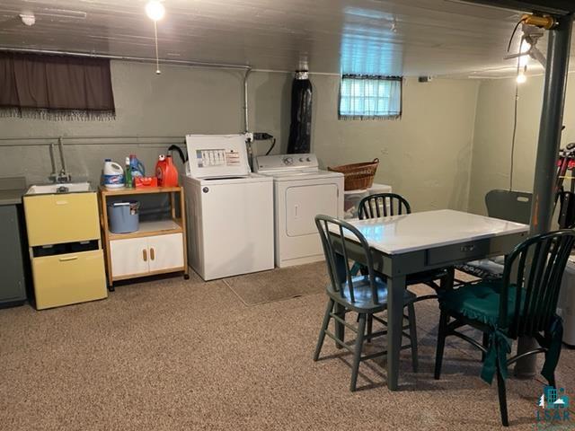 32 West Shagawa Road Ely, MN 55731 - Photo 25 of 26 Basement with washing machine and clothes dryer and carpet flooring