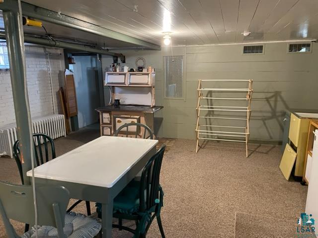 32 West Shagawa Road Ely, MN 55731 - Photo 26 of 26 Dining area featuring radiator and carpet