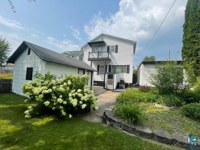 32 West Shagawa Road Ely, MN 55731 - Photo 3 of 26 Back of property with a balcony and a lawn