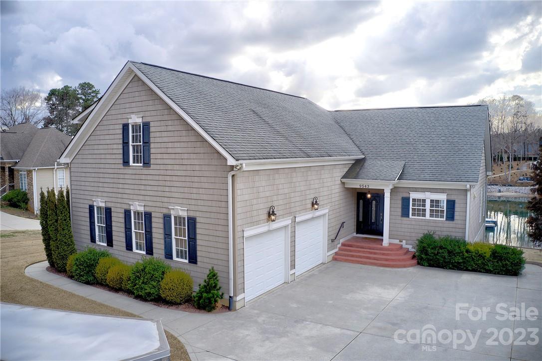 9543 Island Point Road Sherrills Ford, NC 28673 - Photo 1 of 31 a view of a house with a yard and large tree