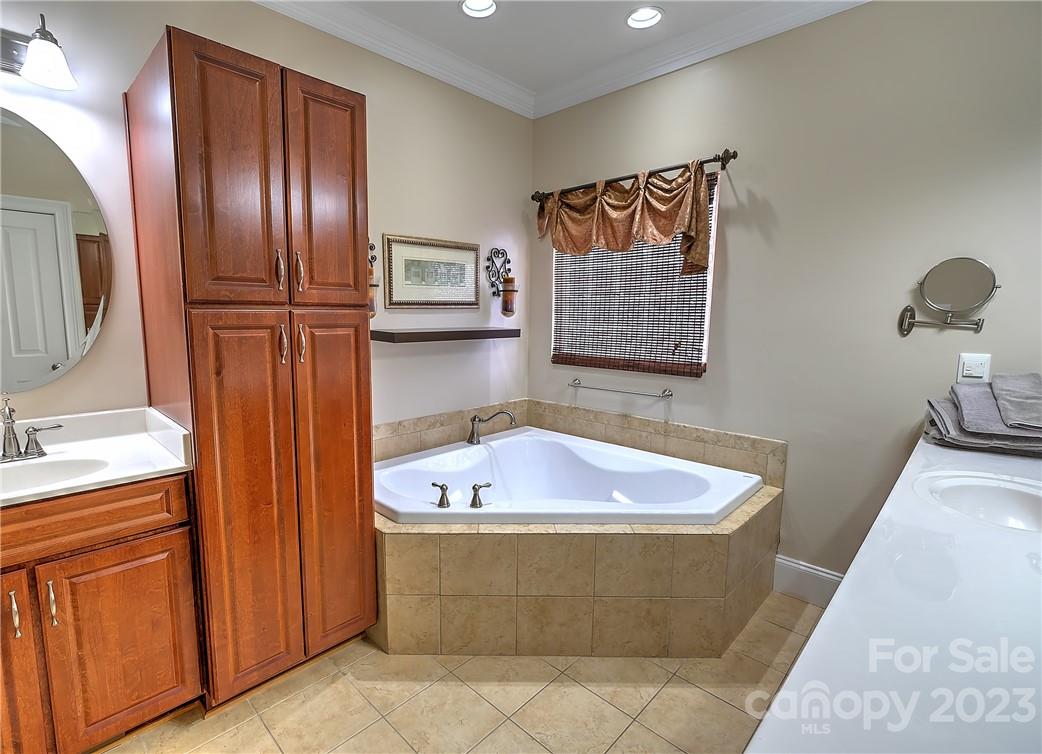 9543 Island Point Road Sherrills Ford, NC 28673 - Photo 11 of 31 a bath tub sitting next to a bathroom sink