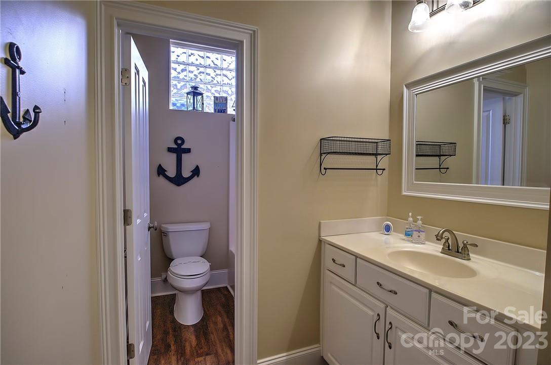 9543 Island Point Road Sherrills Ford, NC 28673 - Photo 13 of 31 a bathroom with a sink a toilet and shower