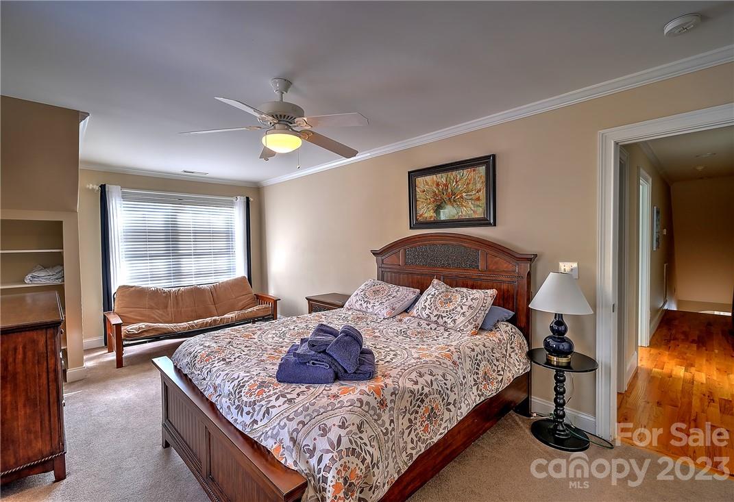 9543 Island Point Road Sherrills Ford, NC 28673 - Photo 15 of 31 a bedroom with a bed and dresser with mirror