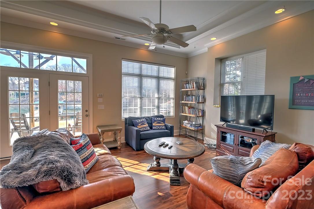 9543 Island Point Road Sherrills Ford, NC 28673 - Photo 18 of 31 a living room with furniture a flat screen tv and a window