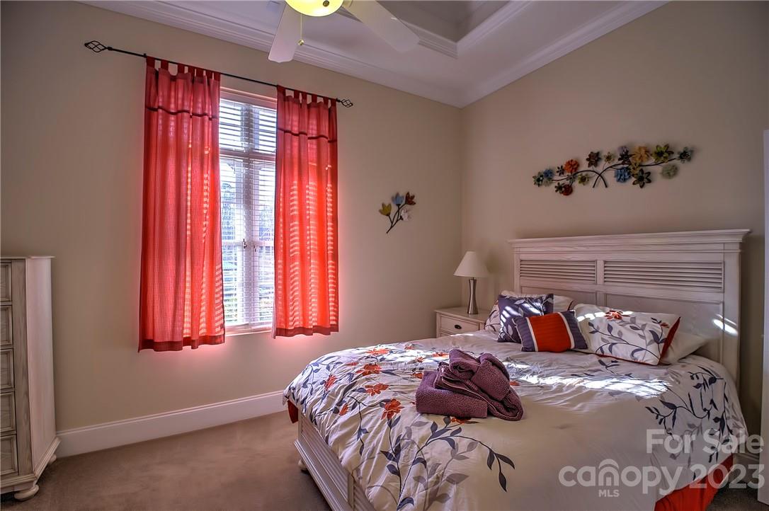 9543 Island Point Road Sherrills Ford, NC 28673 - Photo 20 of 31 a bed sitting in a bedroom next to a window