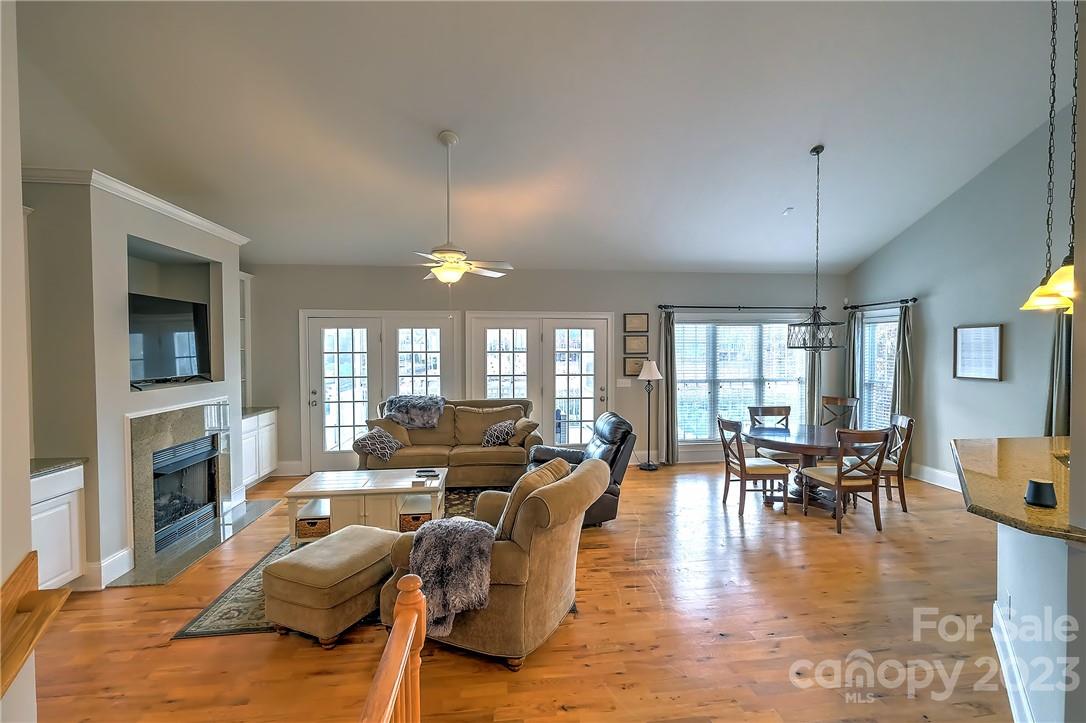 9543 Island Point Road Sherrills Ford, NC 28673 - Photo 3 of 31 a living room with fireplace furniture and a wooden floor