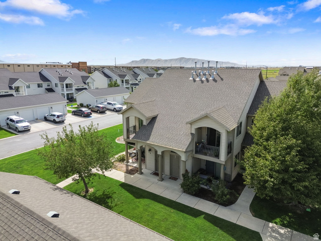 482 South 2500th West, Unit 2 Springville, UT 84663 - Photo 43 of 52 Two-story property featuring a covered porch, upper-level balcony, and mature trees