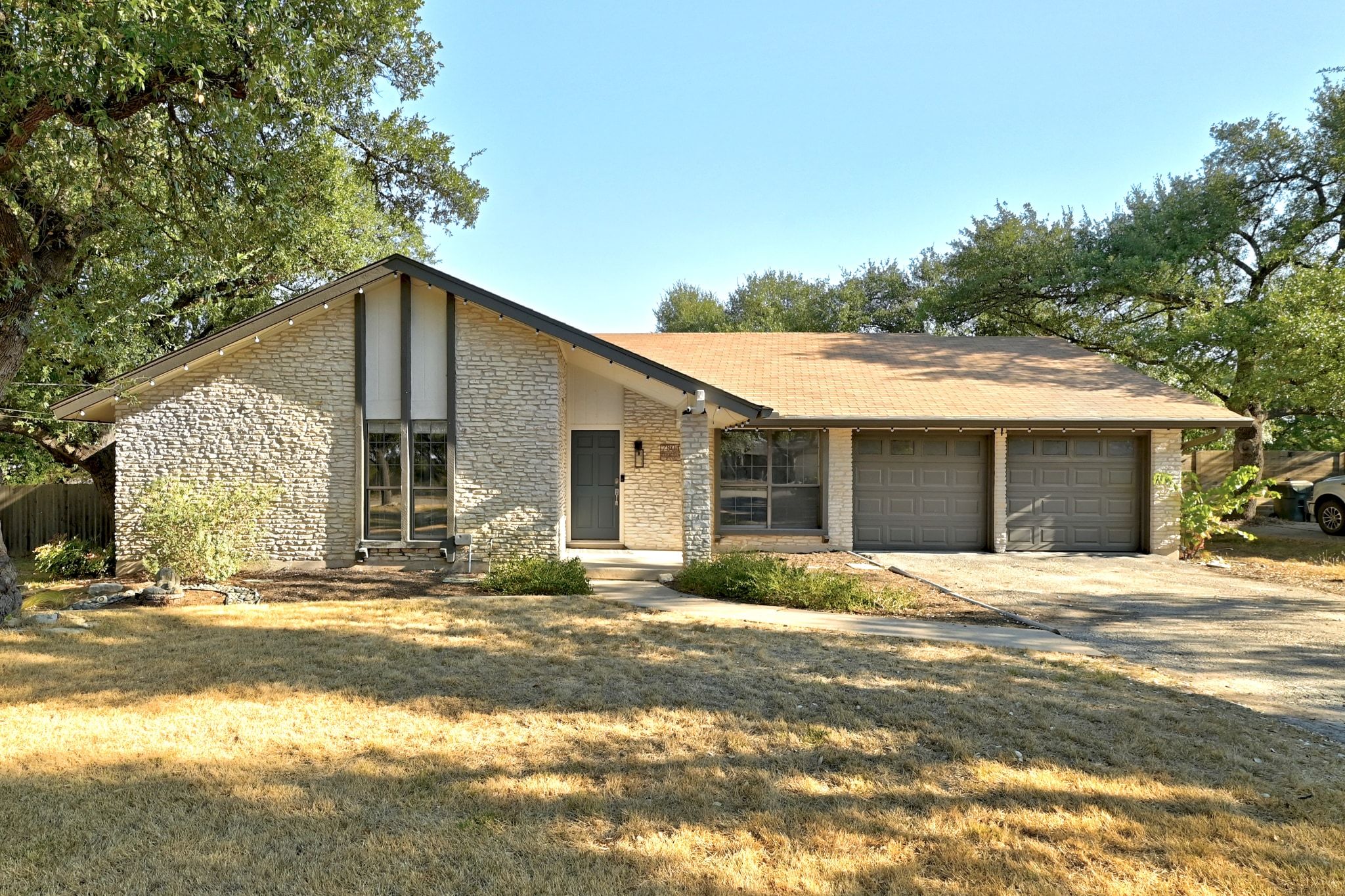 7804 Phoenix Pass Austin, TX 78737 - Photo 1 of 1 a front view of a house with a yard