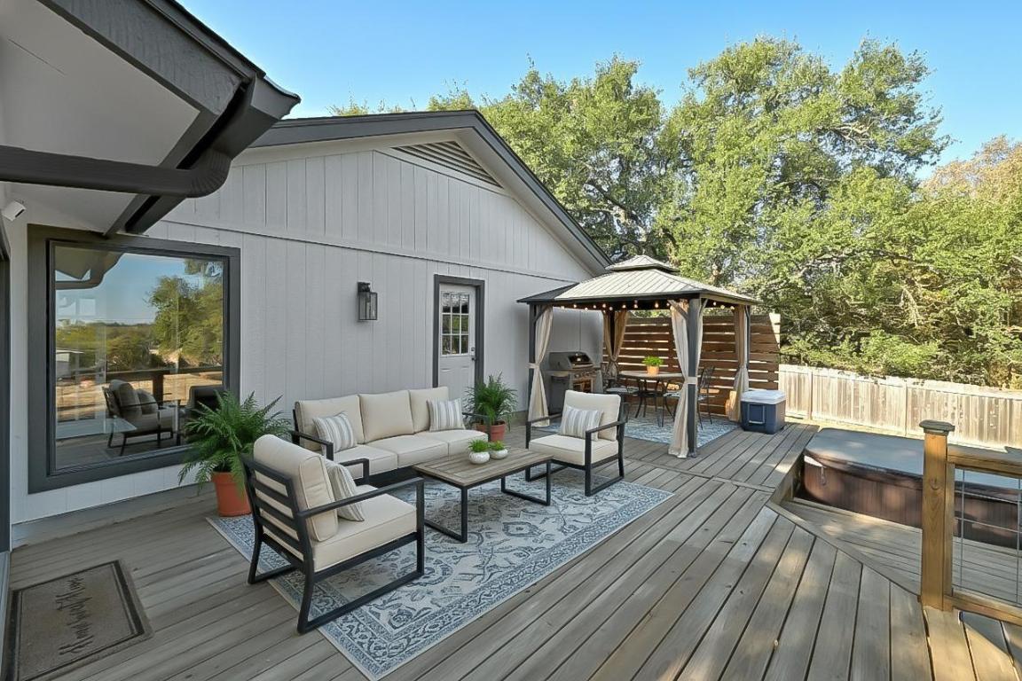 7804 Phoenix Pass Austin, TX 78737 - Photo 11 of 34 Deck with a gazebo, an outdoor hangout area, and a grill