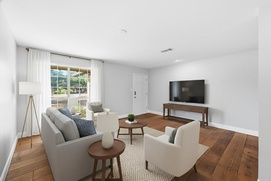 7804 Phoenix Pass Austin, TX 78737 - Photo 10 of 34 Living room featuring baseboards and hardwood / wood-style flooring