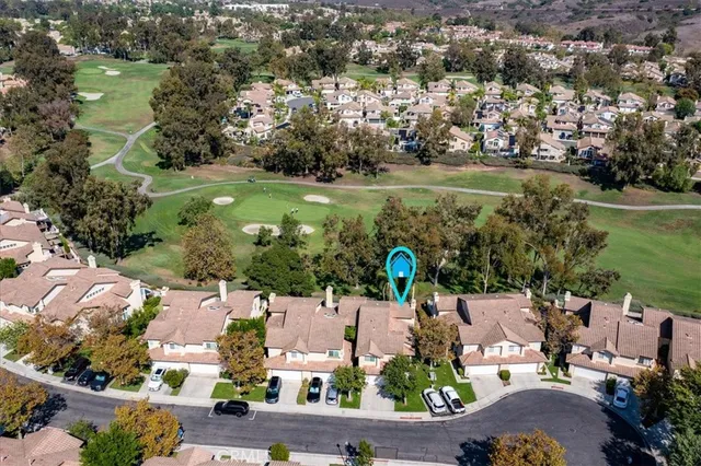 an aerial view of a house with yard swimming pool and outdoor seating