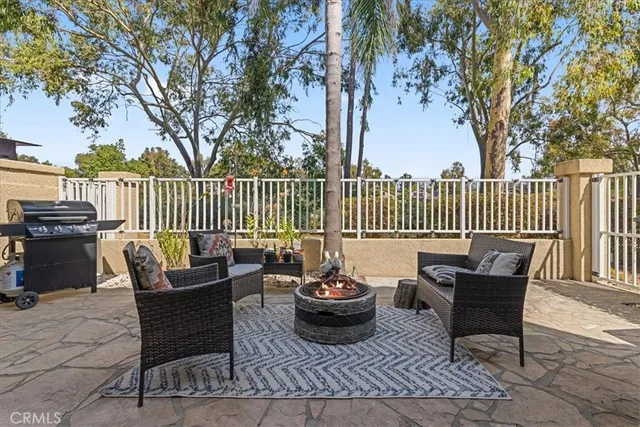 a view of a patio with a table and chairs