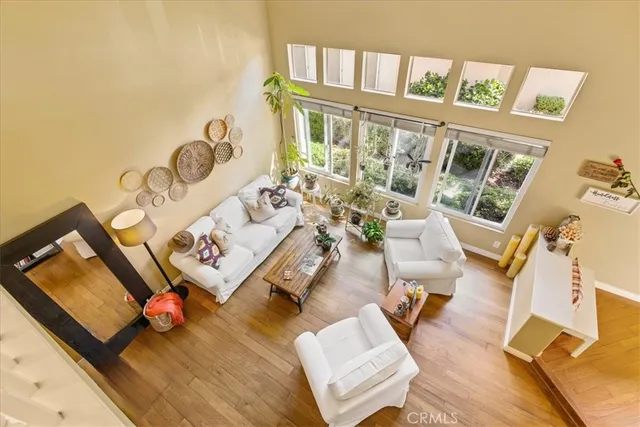 a bedroom with a bed and glass window