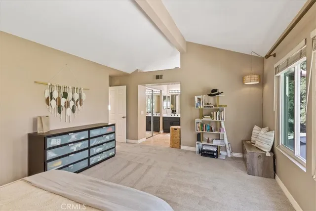 a bathroom with a granite countertop sink a mirror and a shower