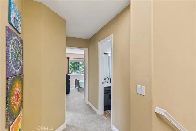 a bathroom with a sink mirror and toilet