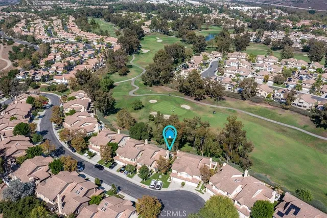 an aerial view of a houses with yard