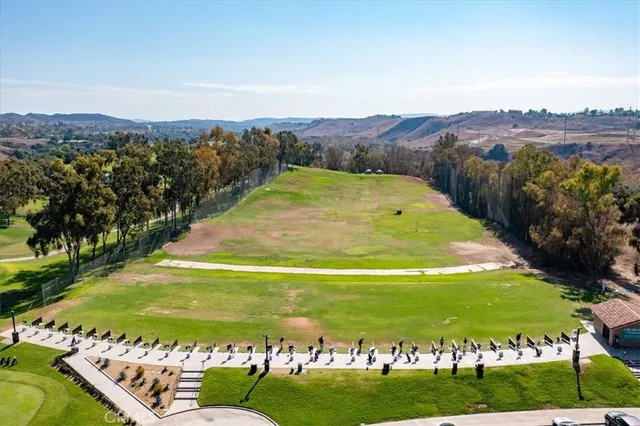 a view of a garden with a building in the background