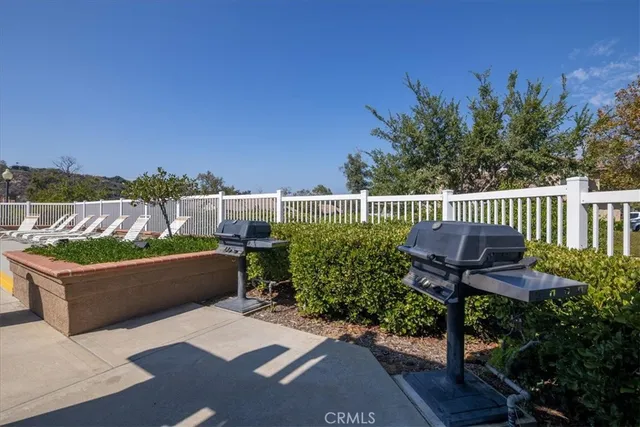 a view of swimming pool with outdoor seating and yard