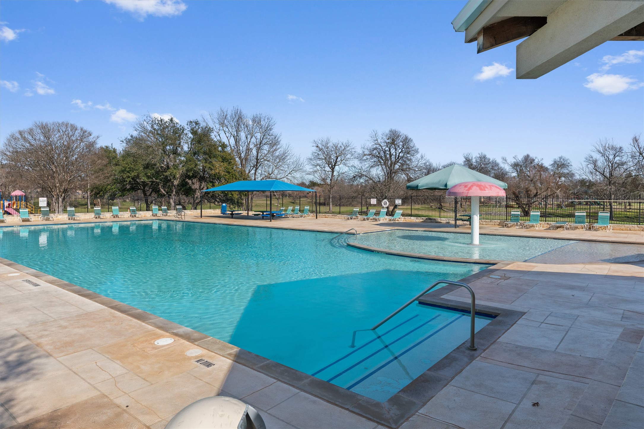 122 Copperwood Loop Round Rock, TX 78665 - Photo 29 of 40 A refreshing pool awaits, complete with a dedicated shallow area and inviting shaded lounges for ultimate relaxation. This pool is perfect for all ages!