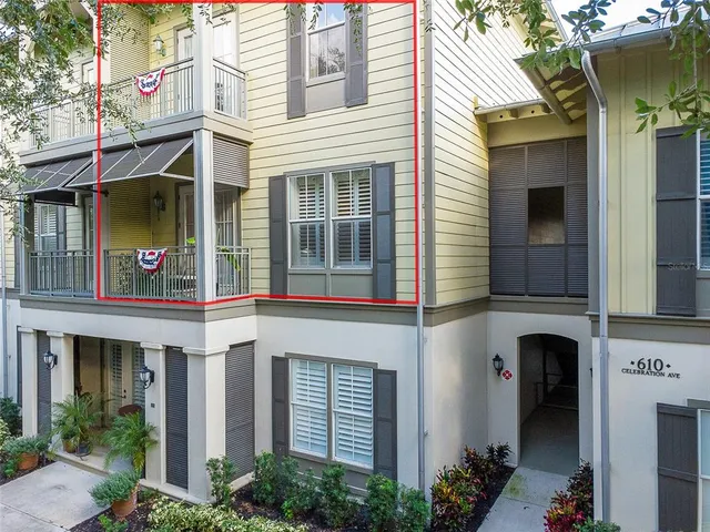 a front view of a house with plants