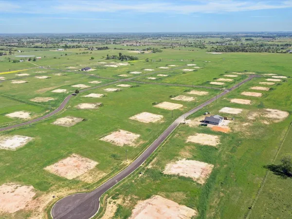 a view of a golf course with a lake