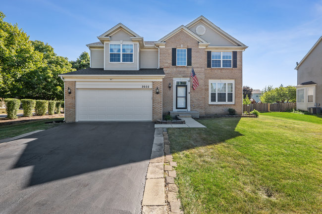 2602 Lundquist Drive Aurora, IL 60503 - Photo 1 of 30 a front view of a house with a yard